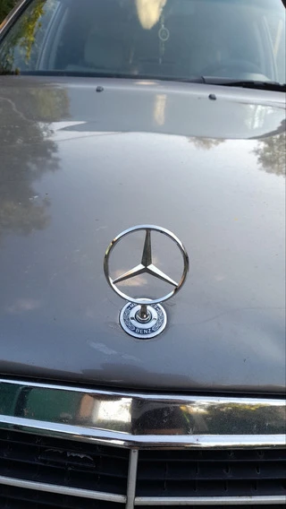 Емблема приціл із написом (для E-class) для Mercedes E-сlass W124 1984-1997 рр